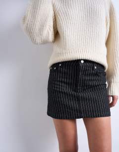 Model wearing Denim pelmet mini skirt in black stripe