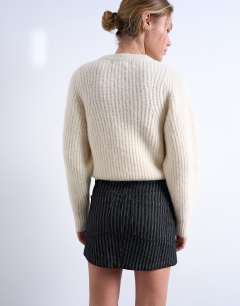 Model wearing Denim pelmet mini skirt in black stripe