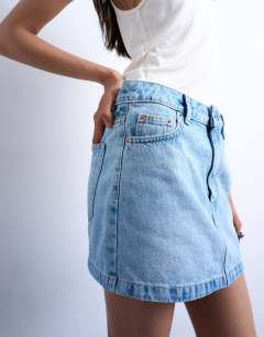 Model wearing Denim pelmet mini skirt in bleach