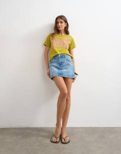 Model wearing Denim pelmet skirt in bleach
