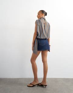 Model wearing Denim pelmet skirt in inidgo rinse