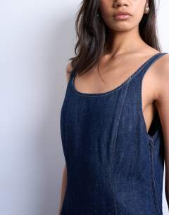 Model wearing Denim pleat detail mini dress in indigo rinse
