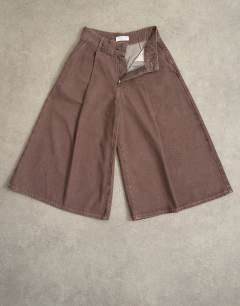 Model wearing Denim pleated culotte in brown rinse