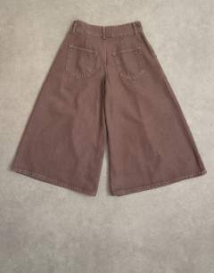 Model wearing Denim pleated culotte in brown rinse