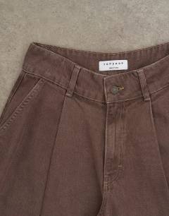 Model wearing Denim pleated culotte in brown rinse