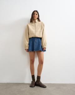 Model wearing Denim pleated full mini skirt in rich blue