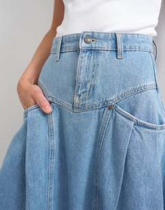 Model wearing Denim pleated maxi skirt in bleach