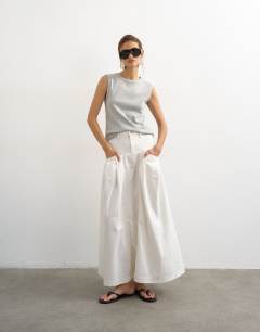 Model wearing Denim pleated maxi skirt in bone