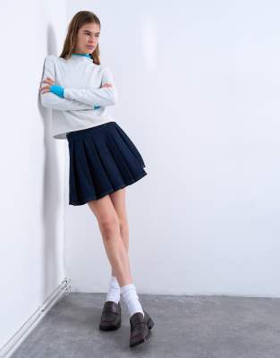 Denim pleated wrap mini skirt in indigo