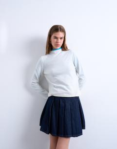 Model wearing Denim pleated wrap mini skirt in indigo