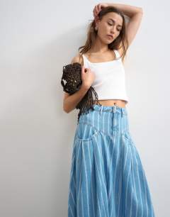 Model wearing Denim pleated yoke maxi skirt in stripe