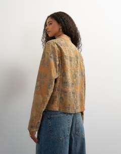 Model wearing Denim printed jacquard jacket in multi