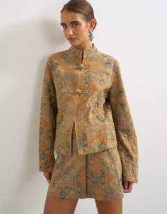 Model wearing Denim printed jacquard wrap mini skirt in multi