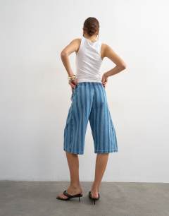 Model wearing Denim pull on barrel short in blue stripe