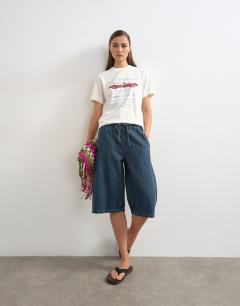Model wearing Denim pull on barrel short in sulphur blue