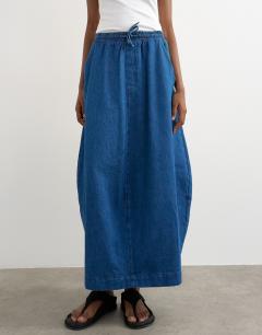Model wearing Denim pull on barrel skirt in rich blue