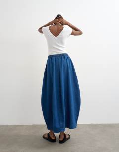 Model wearing Denim pull on barrel skirt in rich blue
