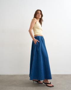 Model wearing Denim pull on circle skirt in mid blue