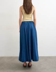 Model wearing Denim pull on circle skirt in mid blue