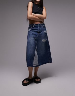 denim raw waistband A-line midi skirt with rips in mid blue