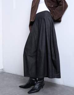 Model wearing Denim seamed barrel maxi skirt in black