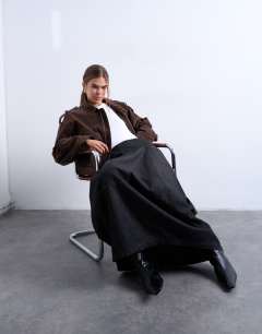 Model wearing Denim seamed barrel maxi skirt in black