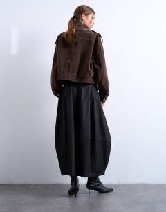 Model wearing Denim seamed barrel maxi skirt in black