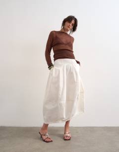 Model wearing Denim seamed barrel maxi skirt in bone