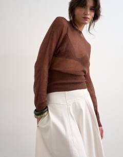 Model wearing Denim seamed barrel maxi skirt in bone