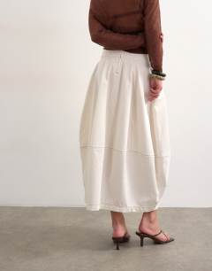 Model wearing Denim seamed barrel maxi skirt in bone