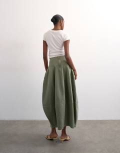 Model wearing Denim seamed barrel maxi skirt in khaki