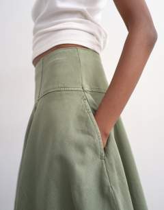 Model wearing Denim seamed barrel maxi skirt in khaki
