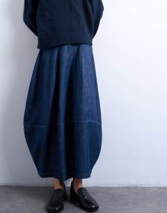 Model wearing Denim seamed barrel maxi skirt in rich blue