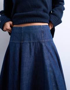 Model wearing Denim seamed barrel maxi skirt in rich blue