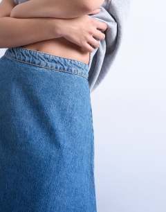 Model wearing Denim seamed circle skirt in mid blue