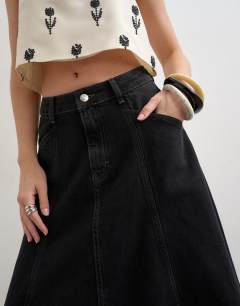 Model wearing Denim seamed circle skirt in washed black