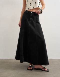 Model wearing Denim seamed circle skirt in washed black