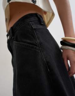 Model wearing Denim seamed circle skirt in washed black