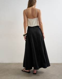 Model wearing Denim seamed circle skirt in washed black