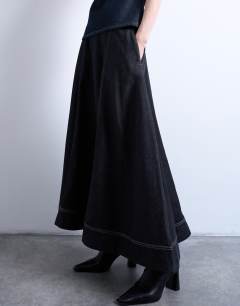 Model wearing Denim seamed full midi skirt in washed black