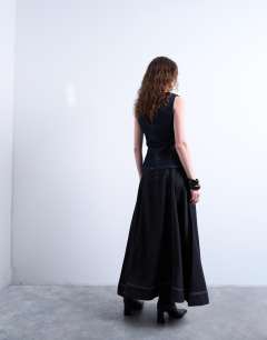 Model wearing Denim seamed full midi skirt in washed black