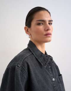 Model wearing Denim shacket with side panel in washed black