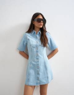 Model wearing Denim short sleeve button down mini dress bleach