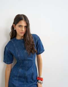 Model wearing Denim short sleeve mini dress in mid blue