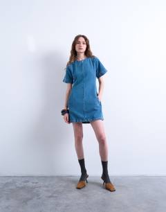 Model wearing Denim short sleeved structured mini dress in mid blue