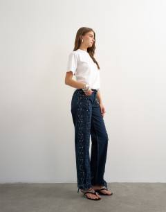 Model wearing Denim straight leg jean with extreme lace-up in deep blue