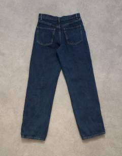 Model wearing Denim straight leg jean with extreme lace-up in deep blue