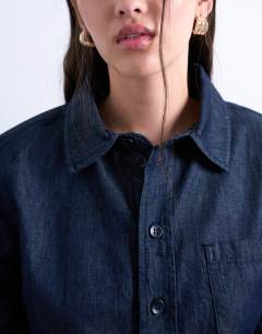 Model wearing Denim strong shoulder pad shirt in indigo