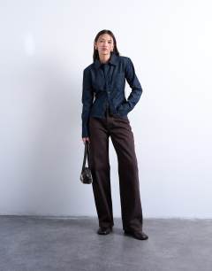 Model wearing Denim strong shoulder pad shirt in indigo