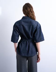 Model wearing Denim tie back oversized boxy shirt in
